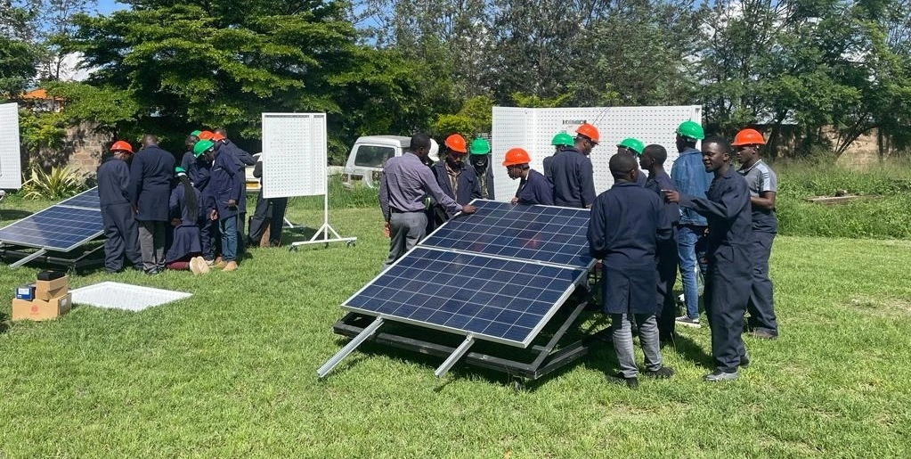 Technicians at Spark Energy Hub receiving training for sustainable energy projects, contributing to a sustainable future for Africa.